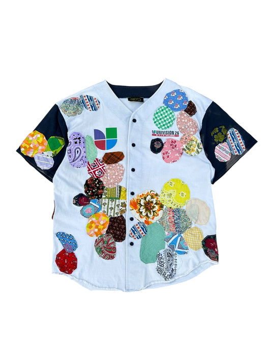 Patched up vintage Univision baseball jersey