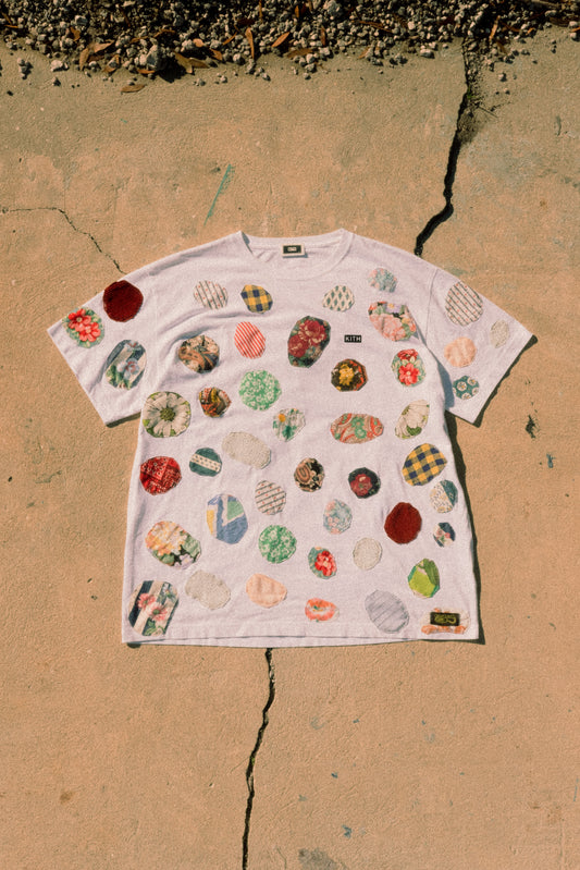 patched up kith tee